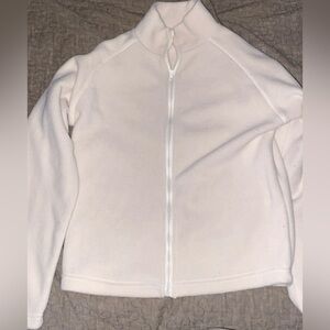 Kinda like a whitish/beige color, medium but could fit a small, good condition